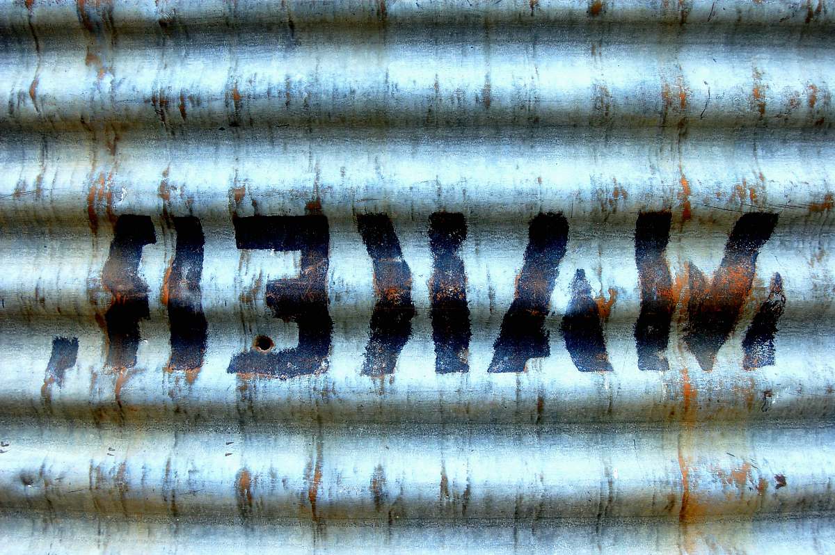 joshua tree national park grey GI sheet with makeh text paint rust